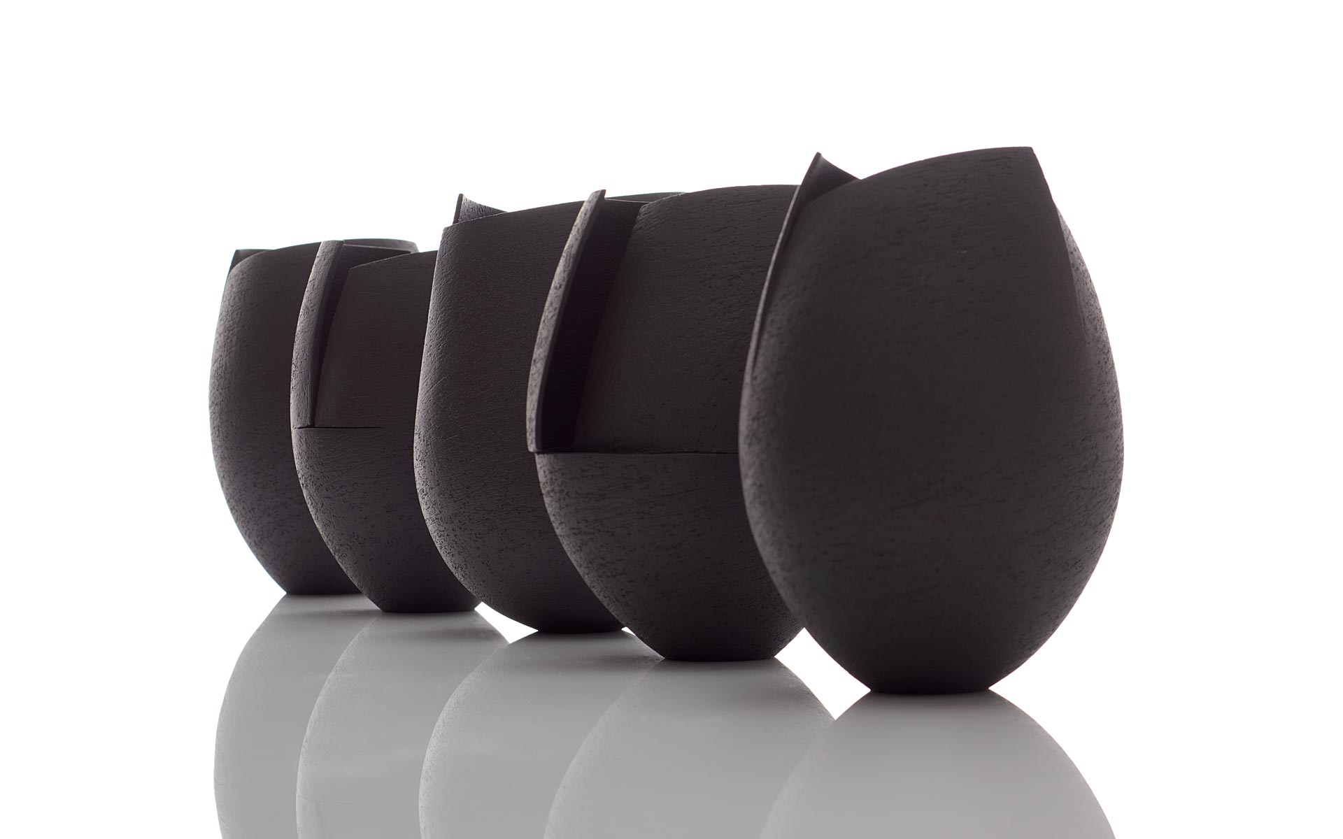 Group of Small Black Cut Vessels